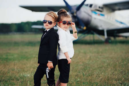 young boy and girl playing spy