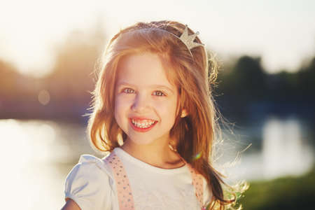 cute little girl in summer parkの写真素材