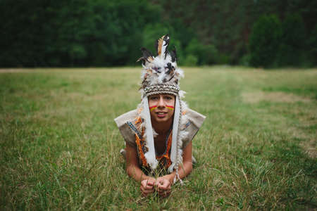 little funny boy playing native americanの写真素材