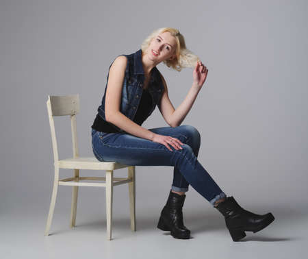 beautiful blonde girl posing in studioの写真素材