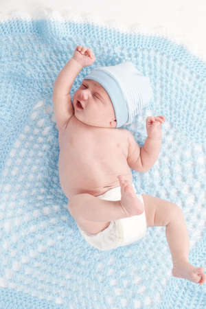 Cute newborn baby in the blanketの写真素材