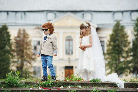 Two funny little bride and groomの写真素材