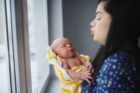 Young mother with newborn babyの写真素材