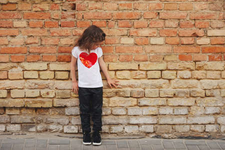happy little girl on the streetの写真素材