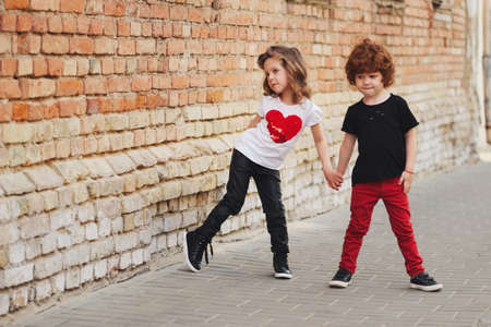 little boy and girl on the streetの写真素材