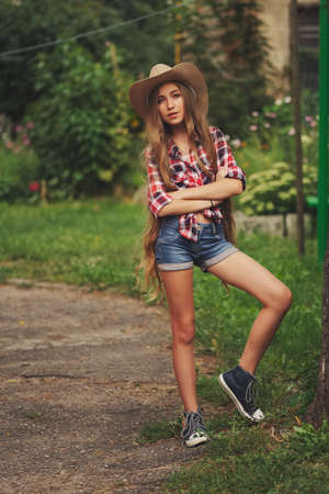beautiful young cowgirl with long hairの写真素材