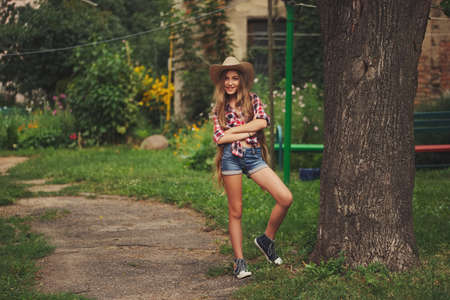 beautiful young cowgirl with long hairの写真素材