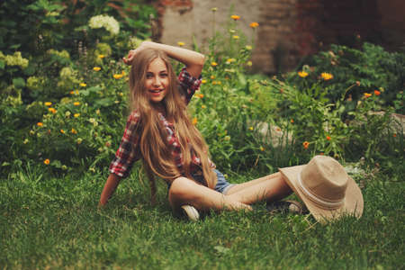 beautiful young cowgirl with long hairの写真素材