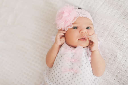 cute newborn girl at homeの写真素材