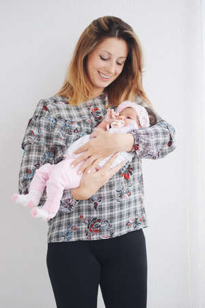 young mother with cute newborn babyの写真素材