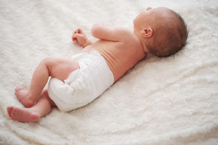 cute newborn baby at homeの写真素材