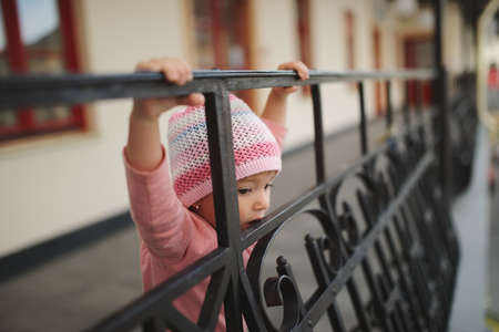 cute little girl on balconyの写真素材