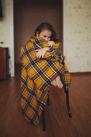 little girl with plaid at homeの写真素材
