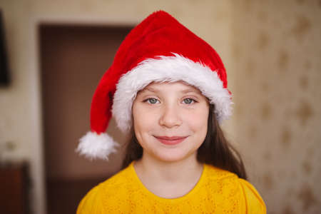 happy little girl with santa hatの写真素材