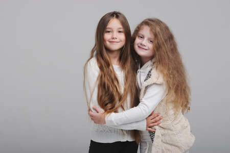 two beautiful girls on white backgroundの写真素材