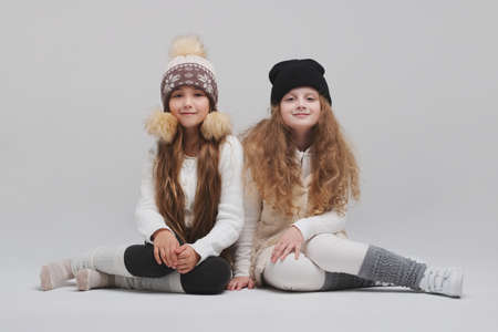 two beautiful girls on white backgroundの写真素材