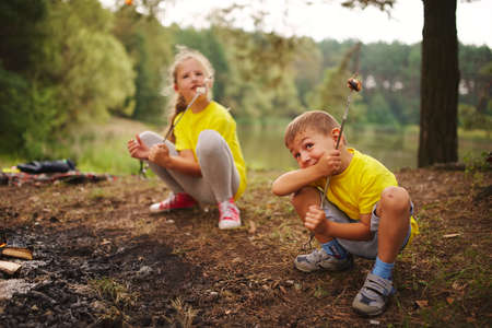 happy children hiking in the forest