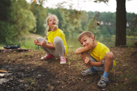 happy children hiking in the forestの写真素材