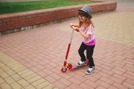 little hipster girl with big glassesの写真素材