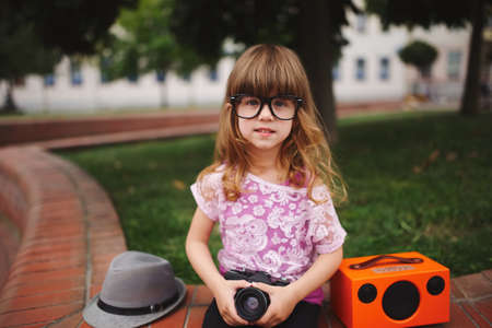 little hipster girl with big glassesの写真素材