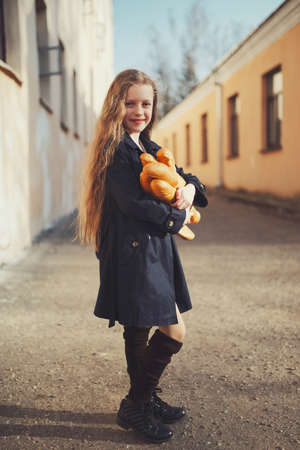 portrait of young beautiful girl with baguetteの写真素材