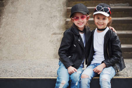 stylish funny little girls on the streetの写真素材