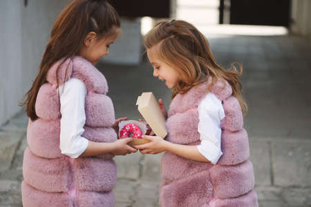 stylish funny little girls on the streetの写真素材