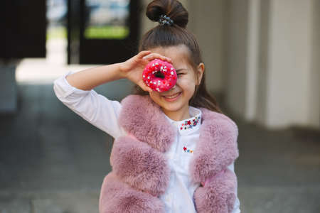 stylish funny little girls on the streetの写真素材