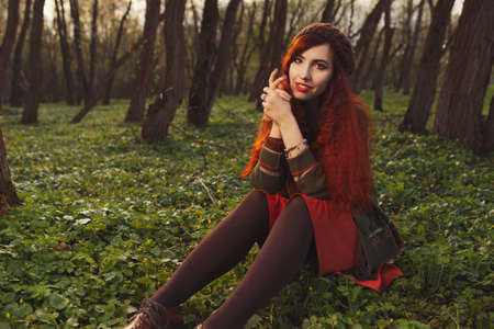 red haired girl in the forest
