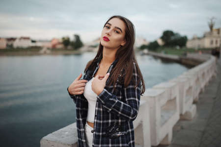 beautiful brunette girl on the streetの写真素材