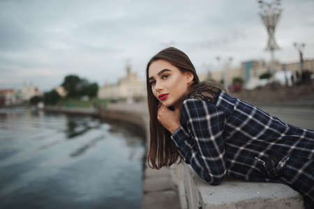 beautiful brunette girl on the streetの写真素材