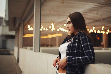 beautiful brunette girl on the streetの写真素材