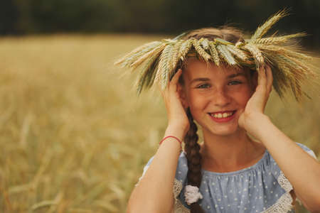 young girl in the yellow fieldの写真素材