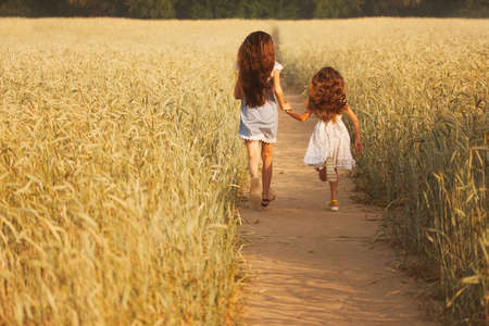beautiful young girl in the yellow field