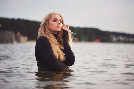 beautiful blonde girl in waterの写真素材