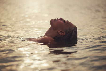 beautiful blonde girl in water