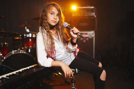 beautiful girl singing in recording studioの写真素材