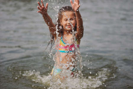 cute happy little girls in sumer lake
