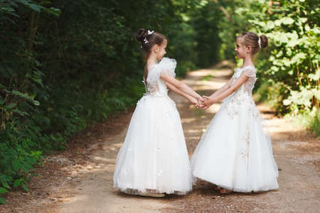 happy beautiful girls with white wedding dressesの写真素材