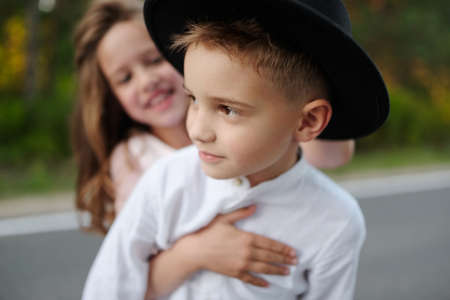 young happy boy and girl together outside