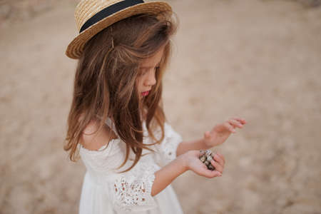young beautiful girl with long hair on the beachの写真素材