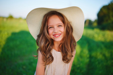 little girl in linen dress in countrysideの写真素材