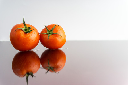Red tomatoes with selective focus and crop fragmentの写真素材