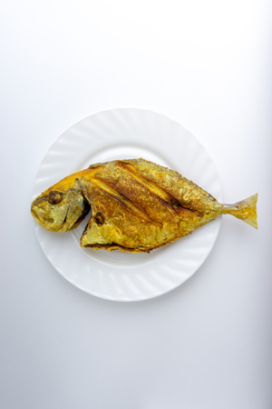 Fried fish on white background with selective focusの写真素材
