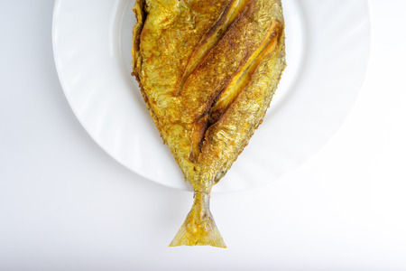 Fried fish on white background with selective focus
