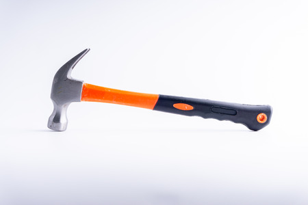 Hammer closeup on white background with selective focus and crop fragmentの写真素材