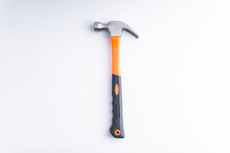 Hammer closeup on white background with selective focus and crop fragmentの写真素材