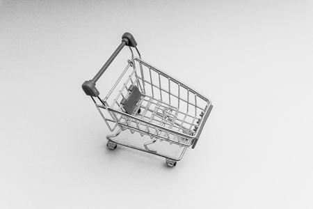 Shopping cart on black and white background, business and shopping concept. Selective focusの写真素材