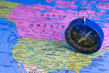 Kuala Lumpur, MALAYSIA FEBRUARY 27, 2019: Compass on world map background. Selective focusのeditorial素材