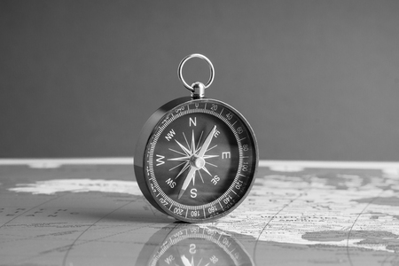 Kuala Lumpur, MALAYSIA FEBRUARY 27, 2019: Compass on world map background. Selective focus,Business and Travel Concept. Black and Whiteのeditorial素材